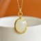 An Exquisite Sterling Silver-Gold Plated Inlaid White Jade Pendant