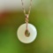 An Exquisite Sterling Silver-Gold Plated Inlaid White Jade Pendant
