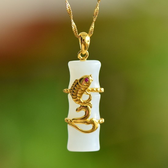 An Exquisite Sterling Silver-Gold Plated Inlaid White Jade Pendant