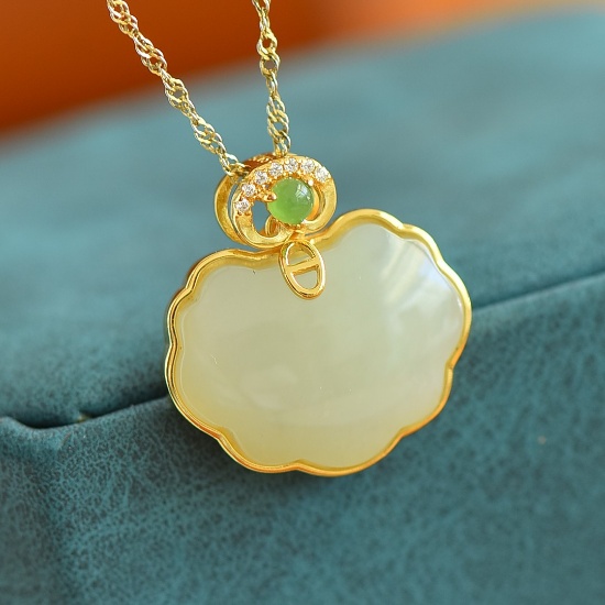 An Exquisite Sterling Silver-Gold Plated Inlaid White Jade Pendant