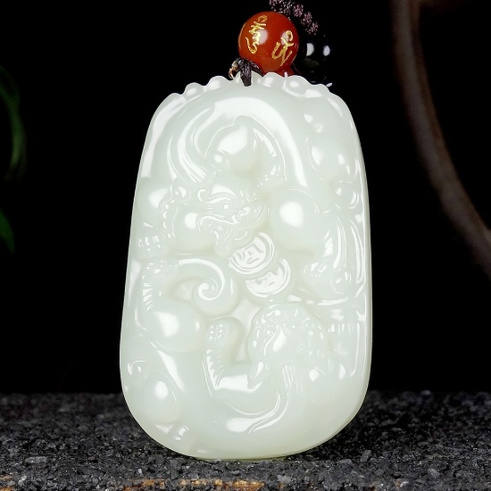 An Exquisite White Jade Auspicious Beast Pendant