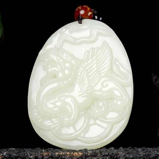 An Exquisite White Jade Auspicious Beast Pendant