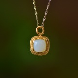 An Exquisite Sterling Silver-Gold Plated Inlaid White Jade Pendant