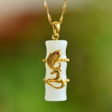 An Exquisite Sterling Silver-Gold Plated Inlaid White Jade Pendant