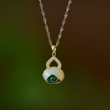An Exquisite Sterling Silver-Gold Plated Inlaid White Jade Pendant
