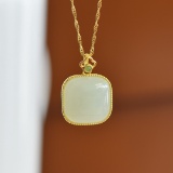 An Exquisite Sterling Silver-Gold Plated Inlaid White Jade Pendant