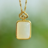 An Exquisite Sterling Silver-Gold Plated Inlaid White Jade Pendant
