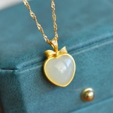 An Exquisite Sterling Silver-Gold Plated Inlaid White Jade Pendant