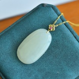 An Exquisite Sterling Silver-Gold Plated Inlaid White Jade Pendant