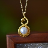 An Exquisite Sterling Silver-Gold Plated Inlaid White Jade Pendant