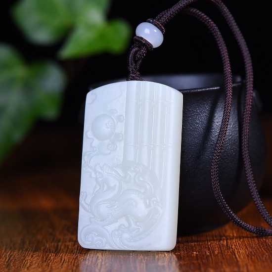 An Exquisite White Jade Auspicious Beast Pattern Pendant