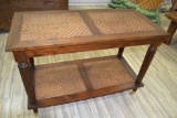 Two Tier Wood and Cane Console Table on Casters