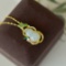 An Exquisite Sterling Silver-Gold Plated Inlaid White Jade Pendant