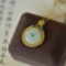 An Exquisite Sterling Silver-Gold Plated Inlaid White Jade Pendant