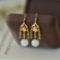 A Pair of Exquisite Sterling Silver-Gold Plated Inlaid White Jade Earrings