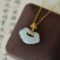 An Exquisite Sterling Silver-Gold Plated Inlaid White Jade Pendant