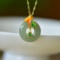 An Exquisite Sterling Silver-Gold Plated Inlaid Jade Pendant