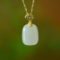 An Exquisite Sterling Silver-Gold Plated Inlaid White Jade Pendant