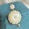 Exquisite Sterling Silver-Gold Plated Inlaid White Jade Pendant