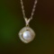 An Exquisite Sterling Silver-Gold Plated Inlaid Pearl Pendant