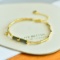 An Exquisite Sterling Silver-Gold Plated Inlaid Jasper Bangle