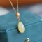 An Exquisite Sterling Silver-Gold Plated Inlaid White Jade Pendant
