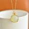 An Exquisite Sterling Silver-Gold Plated Inlaid White Jade Pendant