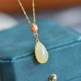 An Exquisite Sterling Silver-Gold Plated Inlaid White Jade Pendant