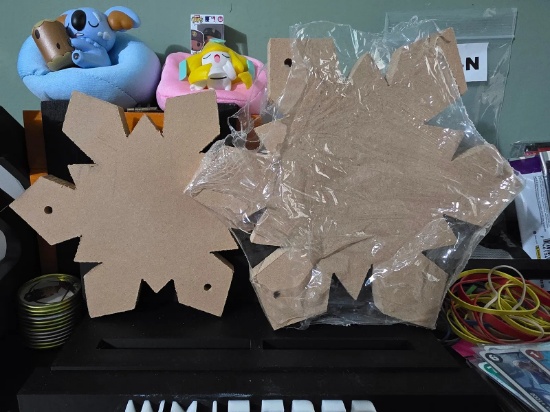2 unfinished wooden snow flakes