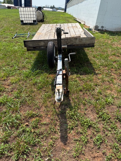 Homemade trailer, single axle, 5 foot and 1/4 wide, 121â€� long, has strap winch