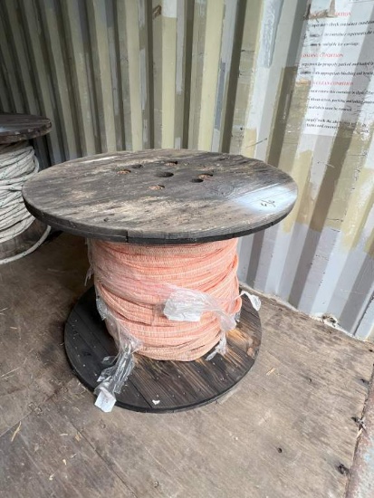 SPOOL OF MESH COVERED CABLE