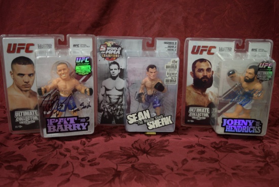 SIGNED FORMER UFC WORLD CHAMP FIGURES!