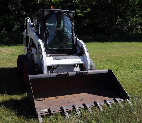 Bobcat S185 diesel skid loader w/enclosed cab, 72" materials bucket, hyd. quick attach, 667 hours