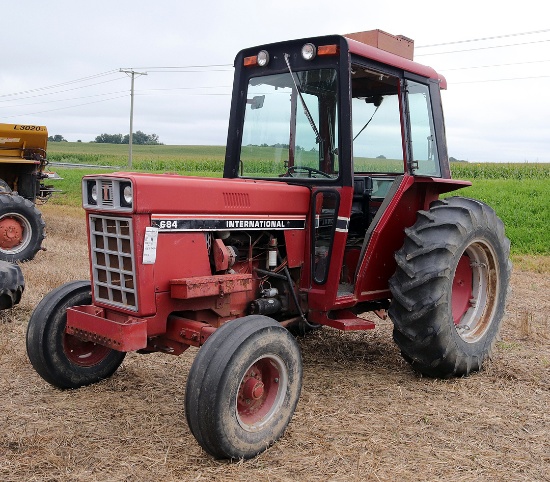 International 684 wide-front utility diesel tractor, Goodyear 69x30 tires, partial cab w/ 2853 hours