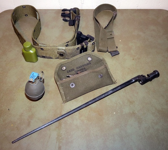 Lot of military items including bayonet, military belts, carrying case, and gas gernade