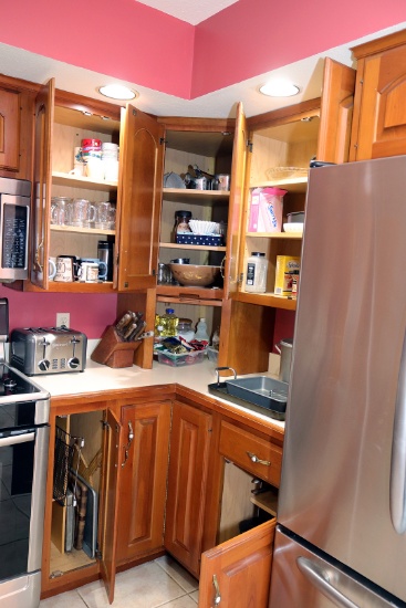 Contents of all remaining kitchen cupboards; pie and cake pans, stockpot, utenils, Pyrex Early Ameri