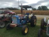 FORD 4000 TRACTOR, 8 SPEED TRANSMISSION, 3 PT PTO, REAR REMOTE, ROLL BAR WITH CANOPY, (5) FRONT WEIG