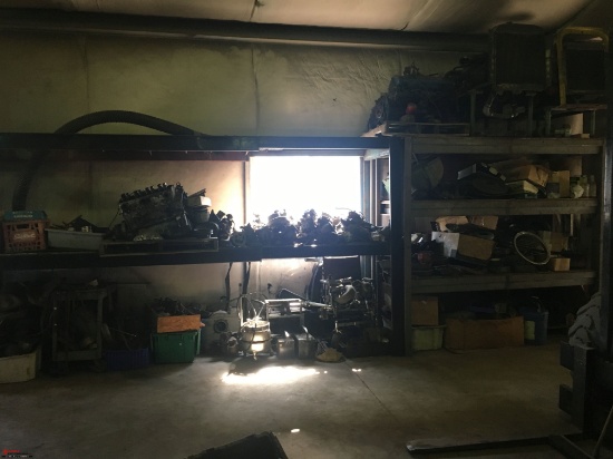 SECTIONS OF PALLET RACKING (2) WITH ASSORTED ENGINES, ALTERNATORS, CARBURETORS, AND OTHER PARTS