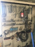 ASSORTED TOOLS HANGING ON WALL, INCLUDES WRENCHES, SOCKETS AND MORE