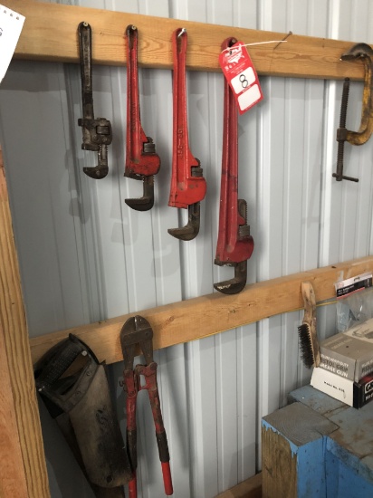ASSORTED TOOLS INCLUDING GREASE GUNS, PIPE WRENCHES, HAND SAWS AND MORE