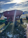 MCCURDY GRAVITY BOX ON JOHN DEERE 1065 GEAR, 11L-15 TIRES, ADJUSTABLE TONGUE