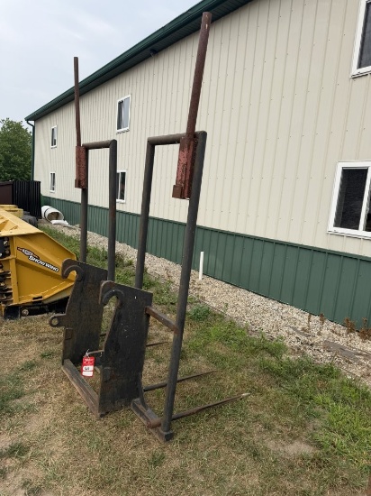 4-tine bale spear with John Deere 544K loader bracket attachment.