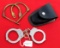 Smith & Wesson handcuffs in holder for belt; some type of restraint marked Whiteaway – Laidlaw & Co.