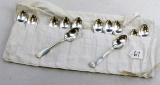 LOT: 12 spoons; Simmons silverware; in cloth holder