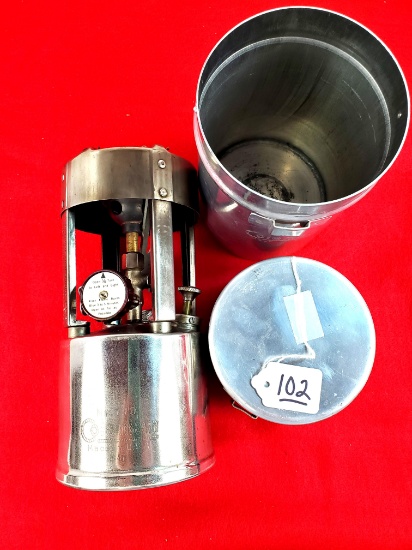 Round Coleman Stove In Canister