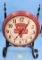E.C. Simmons Keen Kutter round red clock w/original stand