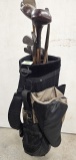 Golf bag w/3 woods; mid iron S/21; mid iron S/20 Simmons Hardware; Nashie S24; Nashie S25; putter S2