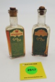 Winchester Glass Gun oil, paper label, one is empty other is full