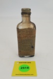 The 303 glass, paper label, combined clean and rust preventer, partial