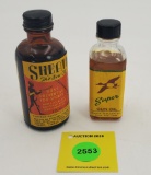 Lot of 2 glass bottles, paper labels, gun oil. Both full